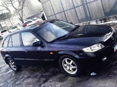 Фото авто Mazda 323