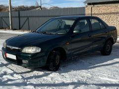 Сүрөт унаа Mazda 323