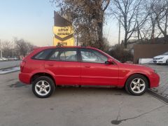 Сүрөт унаа Mazda 323