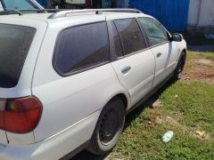 Photo of the vehicle Nissan Primera