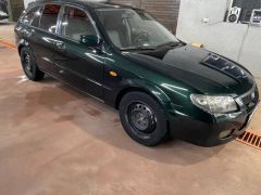 Сүрөт унаа Mazda 323