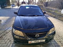 Фото авто Mazda 323