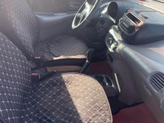 Фото авто Nissan Almera Tino