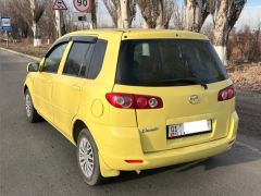 Photo of the vehicle Mazda Demio