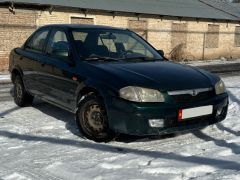 Сүрөт унаа Mazda 323