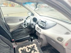 Photo of the vehicle Nissan Almera Tino