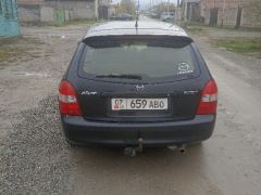 Сүрөт унаа Mazda 323