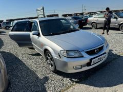 Сүрөт унаа Mazda 323