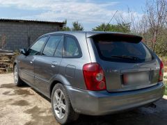 Сүрөт унаа Mazda 323