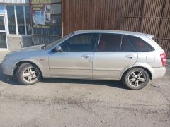 Сүрөт унаа Mazda 323