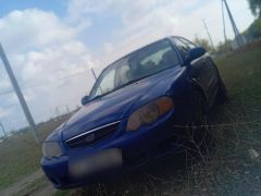 Photo of the vehicle Kia Shuma