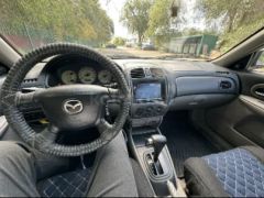 Сүрөт унаа Mazda 323