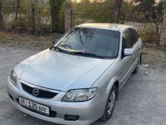 Сүрөт унаа Mazda 323