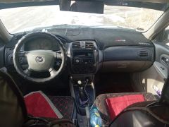 Сүрөт унаа Mazda 323