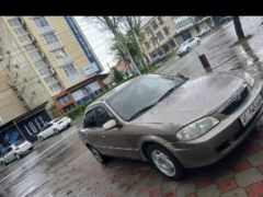 Сүрөт унаа Mazda 323