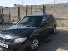 Сүрөт унаа Mazda 323