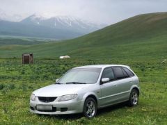 Сүрөт унаа Mazda 323