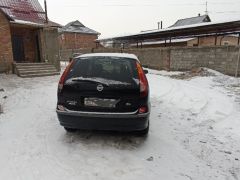 Фото авто Nissan Almera Tino