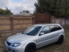 Сүрөт унаа Mazda 323