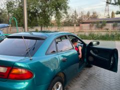 Сүрөт унаа Mazda 323