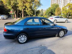 Сүрөт унаа Mazda 323