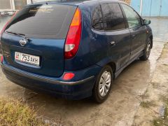 Photo of the vehicle Nissan Almera Tino