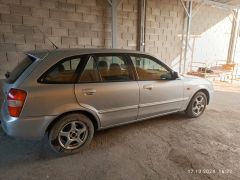 Сүрөт унаа Mazda 323