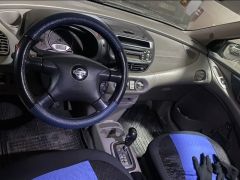 Фото авто Nissan Almera Tino