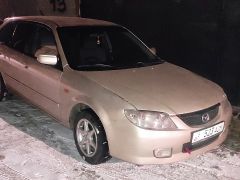 Сүрөт унаа Mazda 323