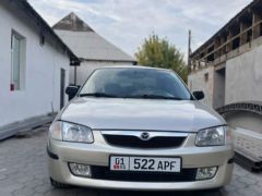 Сүрөт унаа Mazda 323