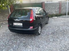 Фото авто Nissan Almera Tino