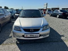 Сүрөт унаа Mazda 323