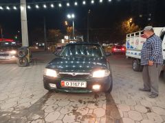 Сүрөт унаа Mazda 323