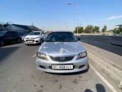 Сүрөт унаа Mazda 323