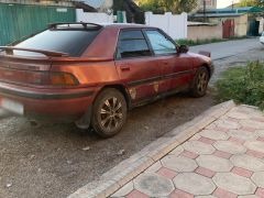 Сүрөт унаа Mazda 323