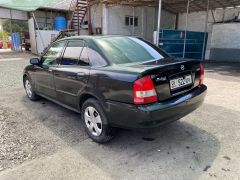 Фото авто Mazda Protege