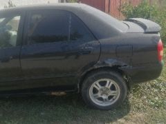 Сүрөт унаа Mazda 323