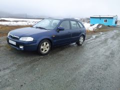 Сүрөт унаа Mazda 323