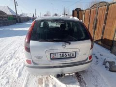 Photo of the vehicle Nissan Almera Tino