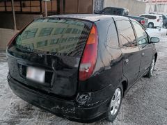 Фото авто Nissan Almera Tino