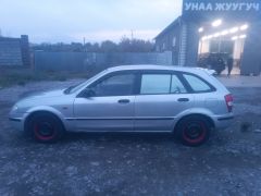 Сүрөт унаа Mazda 323