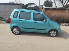 Photo of the vehicle Suzuki Wagon R+