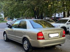 Сүрөт унаа Mazda 323