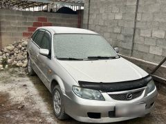 Сүрөт унаа Mazda 323