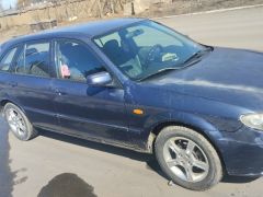 Сүрөт унаа Mazda 323