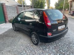 Фото авто Nissan Almera Tino