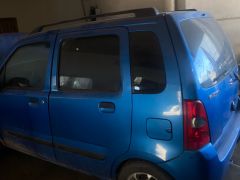 Photo of the vehicle Suzuki Wagon R+