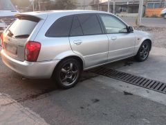 Сүрөт унаа Mazda 323