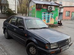 Сүрөт унаа Mazda 323