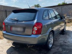 Сүрөт унаа Mazda 323